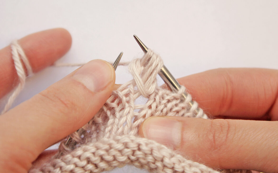 Passing over the first loop of a textured stitch pattern